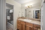 Bathroom with separate sink and shower areas